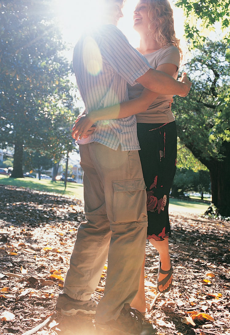 Couple Hugging in Wood